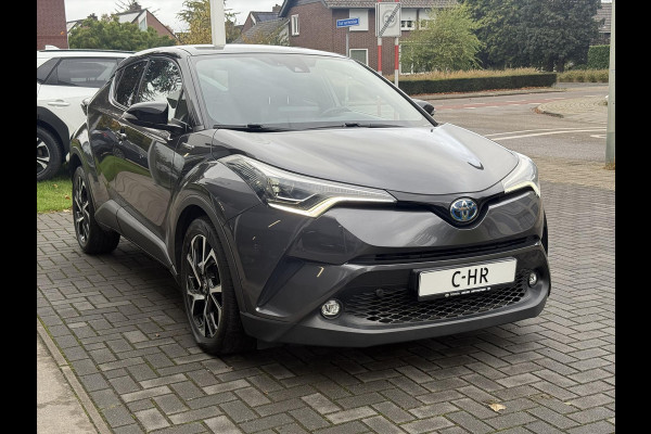 Toyota C-HR 1.8 Hybrid Bi-Tone Plus | Leer, Stoel + Stuurverwarming, Navigatie, Dodehoekherkenning, Parkeersensoren