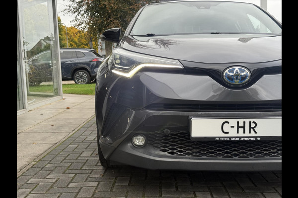 Toyota C-HR 1.8 Hybrid Bi-Tone Plus | Leer, Stoel + Stuurverwarming, Navigatie, Dodehoekherkenning, Parkeersensoren
