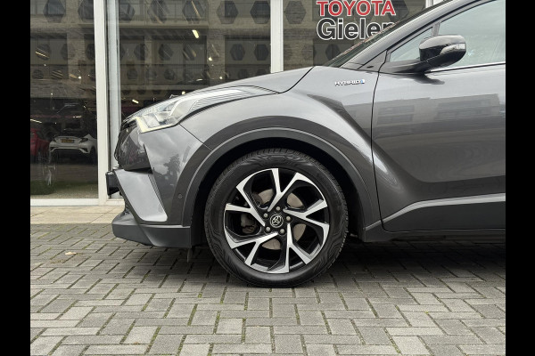 Toyota C-HR 1.8 Hybrid Bi-Tone Plus | Leer, Stoel + Stuurverwarming, Navigatie, Dodehoekherkenning, Parkeersensoren