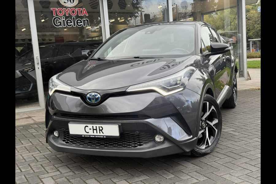 Toyota C-HR 1.8 Hybrid Bi-Tone Plus | Leer, Stoel + Stuurverwarming, Navigatie, Dodehoekherkenning, Parkeersensoren