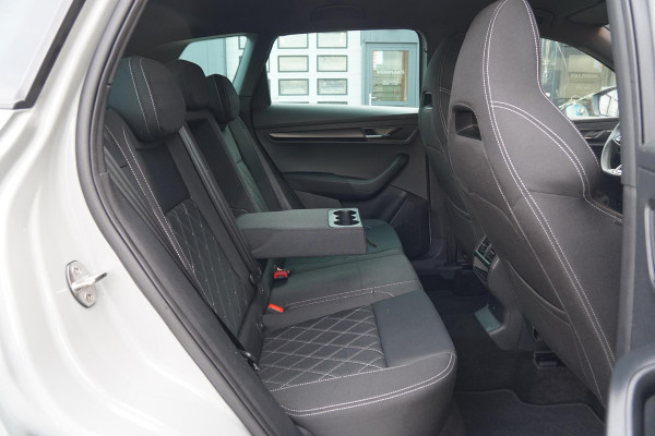 Škoda Karoq 1.5 TSI ACT Sportline Business *EERSTE EIGENAAR* + KEYLESS / CAMERA / CANTON AUDIO / TREKHAAK Škoda Karoq 1.5 TSI ACT Sportline Business *EERSTE EIGENAAR* + KEYLESS / CAMERA / CANTON AUDIO / TREKHAAK