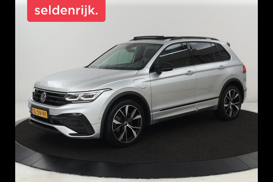 Volkswagen Tiguan 1.4 TSI eHybrid R-Line | Panoramadak | Leder | Trekhaak | 360 Camera | Sfeerverlichting | Adaptive cruise | 20'' | Carplay | Adaptief onderstel | Matrix LED | Park Assist | PHEV | Plug In Volkswagen Tiguan 1.4 TSI eHybrid R-Line | Panoramadak | Leder | Trekhaak | 360 Camera | Sfeerverlichting | Adaptive cruise | 20'' | Carplay | Adaptief onderstel | Matrix LED | Park Assist | PHEV | Plug In