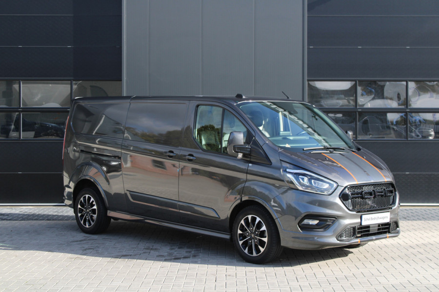 Ford Transit Custom 320 2.0 TDCI L2H1 Sport 185pk - ACC - Trekhaak - Navi - Camera - Stoelverwarming - Blind spot - Xenon - Rijklaar Ford Transit Custom 320 2.0 TDCI L2H1 Sport 185pk - ACC - Trekhaak - Navi - Camera - Stoelverwarming - Blind spot - Xenon - Rijklaar