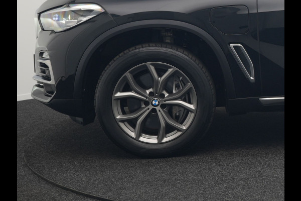 BMW X5 xDrive45e High Executive Plug In Hybrid 395pk Dealer O.H PHEV | Trekhaak Af Fabriek | Luchtvering | Panodak | Head Up | Adaptive Cruise | 360 Camera | Adaptief Onderstel | Lederen Sportstoelen Memory & Verwarmd | Apple Carplay | Sfee BMW X5 xDrive45e High Executive Plug In Hybrid 395pk Dealer O.H PHEV | Trekhaak Af Fabriek | Luchtvering | Panodak | Head Up | Adaptive Cruise | 360 Camera | Adaptief Onderstel | Lederen Sportstoelen Memory & Verwarmd | Apple Carplay | Sfee