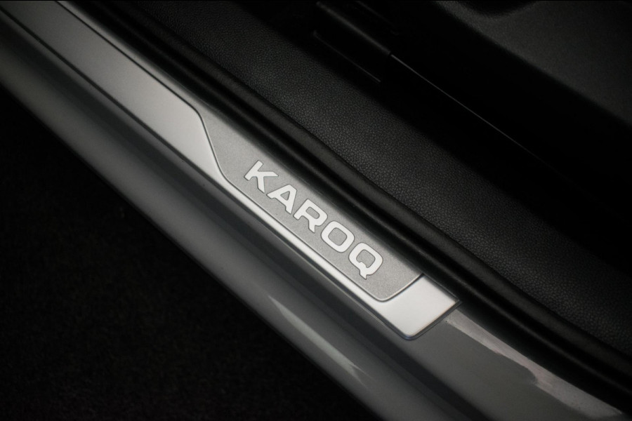 Škoda Karoq 1.0 TSI Ambition Sport [ Panoramadak El Trekhaak Camera Sportinterieur Stoelverwarming Carplay ]