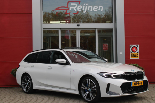 BMW 3 Serie Touring 330e 292PK M-SPORT | M-SPORT PRO-PAKKET | M-SPORT REMMEN UITGEVOERD IN DONKERBLAUW MET M LOGO | BMW LIVE COCKPIT PROFESSIONAL | CURVED DISPLAY |DRIVING ASSISTANT INCL. HEAD-UP DISPLAY | PANORAMISCH SCHUIF/KANTEL DAK | PARKING ASSIST INCL. ACHTERUITRIJCAMERA | ADAPTIEVE LED KOPLAMPEN |SHADOW LINE | M-SPORTSTOELEN VOOR | LEDER VERNASCA MET CONTRAST STIKSELS M-SPORT | STOEL VERWARMING | DRAADLOZE APPLE CARPLAY | ELEKTRISCH VERSTELBARE STOELEN MET GEHEUGEN FUNCTIE | HEAD UP DISPLAY | DRAADLOZE TELEFOONLADER | DODEHOEK BEWAKING | COMFORT PACK INCL. ELEKTRISCHE ACHTE