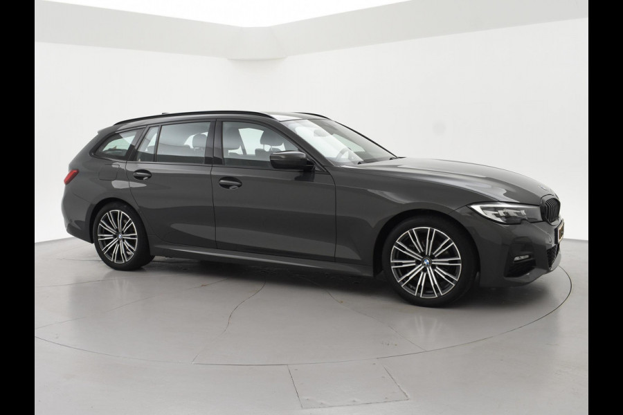 BMW 3 Serie Touring 318i AUT. M-SPORT DRAVITGRAU + SPORTSTOELEN | CAMERA | MEMORY | HIFI | SFEERVERLICHTING | CARPLAY