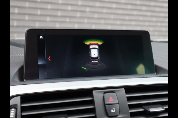 BMW 1-serie 118i High Executive M Sport Pakket Automaat 5 deurs / Navigatie Professional / Leder / 18 Inch / Shadow Line / Stoelverwarming / LED / Parkeersensoren voor+achter / Cruise Control / DAB / Lichtpakket