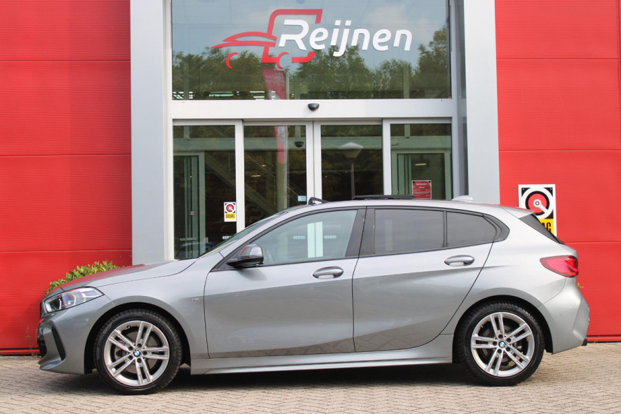 BMW 1-serie 118i 136PK M-SPORT EDITION | PANORAMISCH SCHUIF/KANTEL DAK |  SFEER VERLICHTING | SHADOW LINE PAKKET | LEDEREN BEKLEDING "DAKOTA GEPERFOREERD" | VERWARMBARE VOORSTOELEN | LEDEREN M-SPORT STUUR | NAVIGATIE | ACHTERUITRIJCAMERA | PARKEERSENSOREN VOOR EN ACHTER | ALARM | CLIMATE CONTROL | DRAADLOZE APPLE CARPLAY/ANDROID AUTO | LICHTMETALEN VELGEN M-SPORT | FULL LED KOPLAMPEN | LANE ASSIST | DAB+ RADIO | SPORT STOELEN | WARMTE WEREND GLAS  | EXTRA GETINTE ACHTERRUITEN | ELEKTRISCH VERSTELBARE BUITENSPIEGELS | BUITENSPIEGELS VERWARMBAAR | ARMSTEUN ACHTER |BMW LIVE COCKPIT P