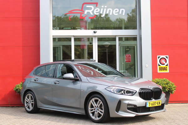 BMW 1-serie 118i 136PK M-SPORT EDITION | PANORAMISCH SCHUIF/KANTEL DAK |  SFEER VERLICHTING | SHADOW LINE PAKKET | LEDEREN BEKLEDING "DAKOTA GEPERFOREERD" | VERWARMBARE VOORSTOELEN | LEDEREN M-SPORT STUUR | NAVIGATIE | ACHTERUITRIJCAMERA | PARKEERSENSOREN VOOR EN ACHTER | ALARM | CLIMATE CONTROL | DRAADLOZE APPLE CARPLAY/ANDROID AUTO | LICHTMETALEN VELGEN M-SPORT | FULL LED KOPLAMPEN | LANE ASSIST | DAB+ RADIO | SPORT STOELEN | WARMTE WEREND GLAS  | EXTRA GETINTE ACHTERRUITEN | ELEKTRISCH VERSTELBARE BUITENSPIEGELS | BUITENSPIEGELS VERWARMBAAR | ARMSTEUN ACHTER |BMW LIVE COCKPIT P