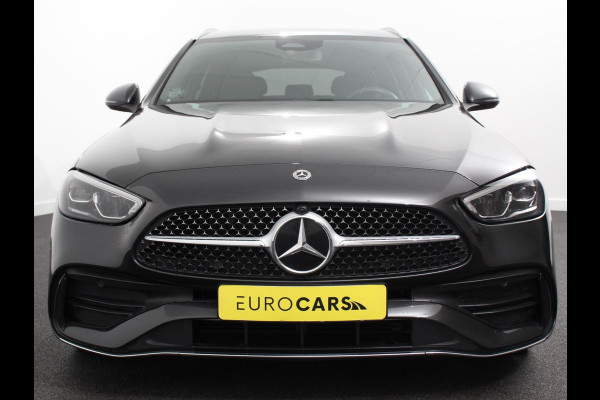 Mercedes-Benz C-Klasse Estate 200 AMG Line | Climate control | Achteruitrijcamera | Wegklapbare trekhaak | Navigatie | Dodehoek assistent | LED | Sfeerverlichting | Adaptieve cruise control | Verwarmde voorstoelen | Elektrische kofferbak