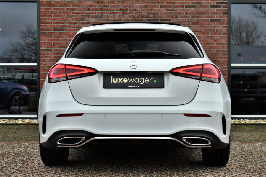 Mercedes-Benz A-Klasse 180 AMG Pano Trekhaak Camera Night Metallic-wit