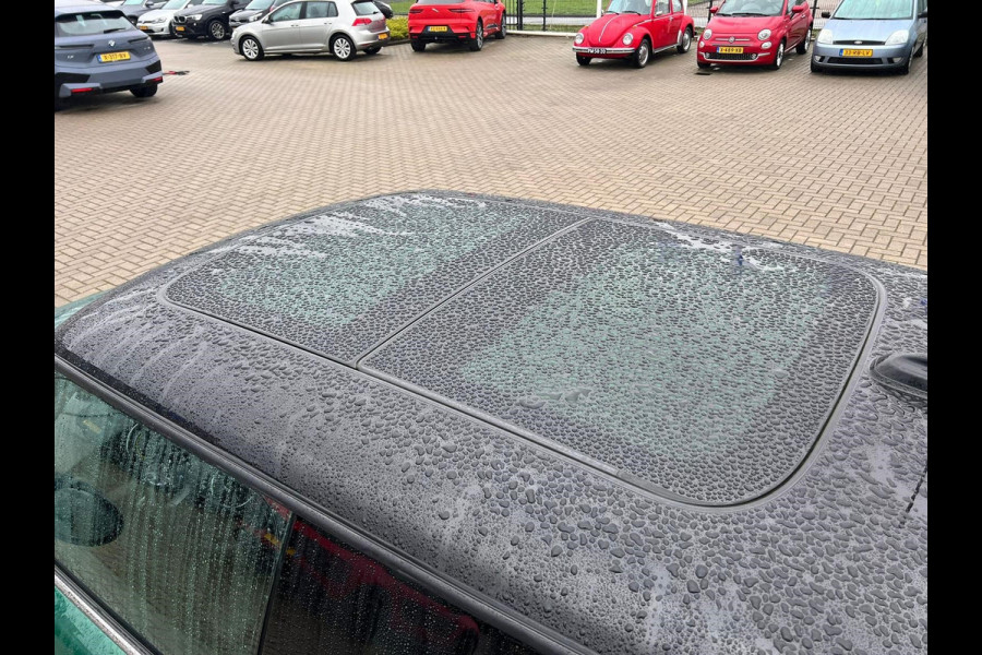 MINI Mini Electric Classic 33 kWh | Panoramadak | Leer | Headup | Stoel- en Stuurverw. | Harman Kardon | Camera | Adap. Cruise | British racing green, zwart dak, Extra getint glas achter, Comfortstoelen, Navigatie, Apple carplay/Android auto