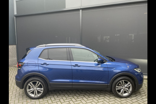 Volkswagen T-Cross Automaat 1.5 TSI Style Business R design automaat Airco - Cruise control - Parkeersensoren voor en achter - Navigatie - Dakrails - Bluetooth - Dodehoek detector - Stuur leder - Stuur multifunctioneel - Start/stop systeem - Radio - Licht metalen velgen 17 inch