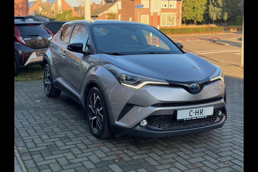 Toyota C-HR 1.8 Hybrid Bi-Tone Plus | JBL, LED Pakket, Dodehoekherkenning, Navigatie, Parkeersensoren, Stoelverwarming, Keyless, 18 inch