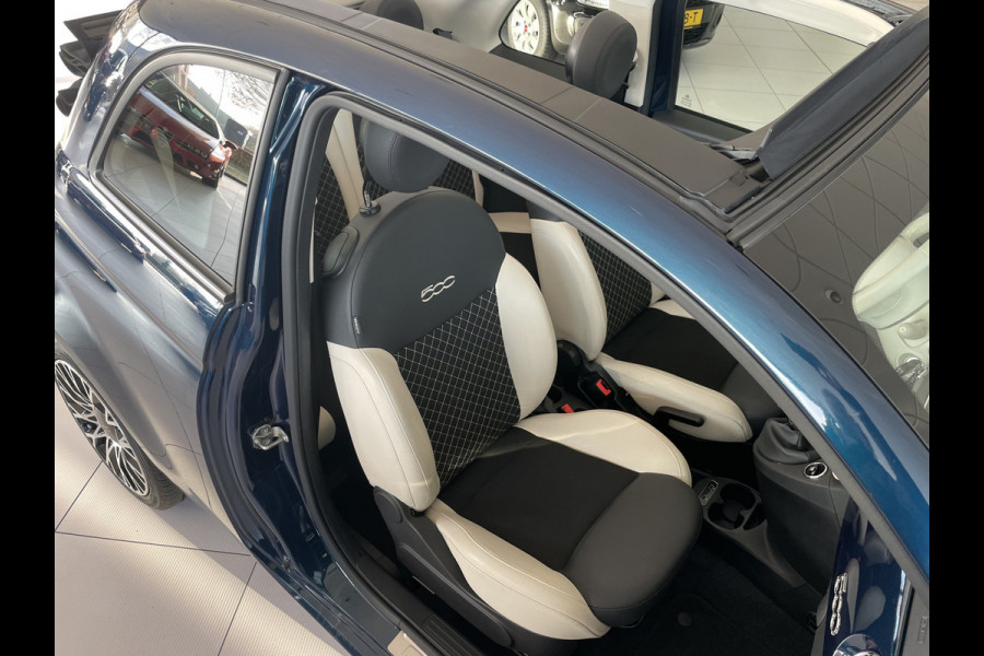 Fiat 500 1.0 Hybrid Airco - Cruise control - Parkeersensoren achter - Open dak - Bluetooth - Navigatiesysteem - Mistlampen voor - Stuur multifunctioneel - Elektrische ramen voor - Stuur leder - Licht metalen vel