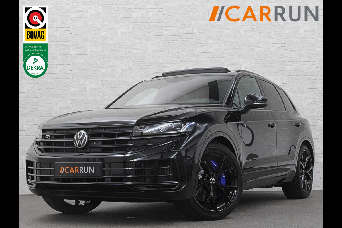 Volkswagen Touareg R 3.0 TSI 462PK E-Hybrid | Luchtvering | Puglia-Leder | Panorama | DYN-Audio | Massage | Ventilatie | ACC | Trekhaak | Nachtzicht | Head-Up | Ergo-Comfort | 22" | Keyless-Entry | Memory | 4-Zone Clima | ISO-Glas | Stoelverwarming V+A | Dodehoek | Standkachel | Carplay | Draadloos Laden |