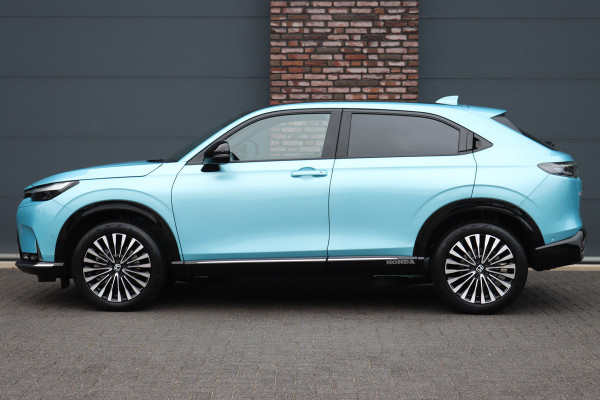 Honda e:Ny1 Elegance 69 kWh | Panoramadak | Adaptieve Cruise Control | Verwarmd Stuurwiel | Leder | Surround Camera | Apple Carplay/Android Auto | Dodehoekassistent | Stoelverwarming |