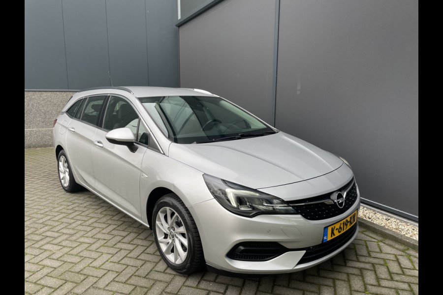 Opel Astra Sports Tourer 1.2 Business Elegance Airco - Cruise control - Parkeersensoren voor en achter - Achteruitrijcamera - Navigatie - Bluetooth - Keyless start and entry - Start/stop systeem - Stuur leder - Stuur multifunctioneel