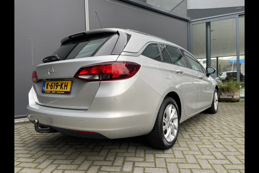 Opel Astra Sports Tourer 1.2 Business Elegance Airco - Cruise control - Parkeersensoren voor en achter - Achteruitrijcamera - Navigatie - Bluetooth - Keyless start and entry - Start/stop systeem - Stuur leder - Stuur multifunctioneel