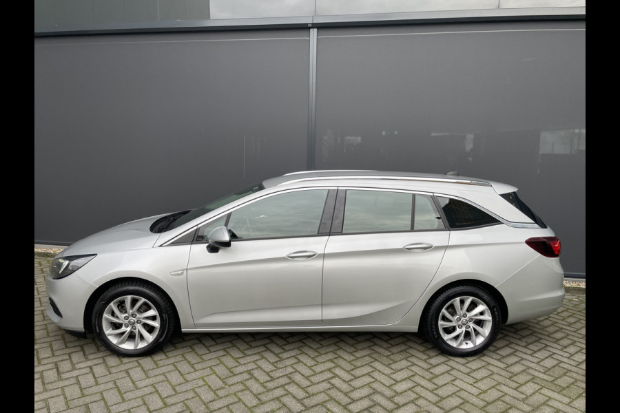 Opel Astra Sports Tourer 1.2 Business Elegance Airco - Cruise control - Parkeersensoren voor en achter - Achteruitrijcamera - Navigatie - Bluetooth - Keyless start and entry - Start/stop systeem - Stuur leder - Stuur multifunctioneel