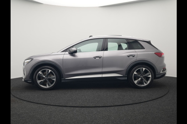 Audi Q4 e-tron 50 quattro S Line 77 kWh 299pk Dealer O.H. INCL BTW | Panodak | Lederen Sportstoelen Verwarmd | Keyless | Navigatie | Cruise Control | Virtual | DAB | Taifungrau Metallic |