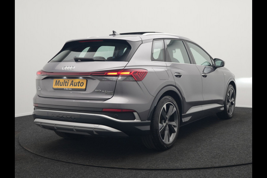 Audi Q4 e-tron 50 quattro S Line 77 kWh 299pk Dealer O.H. INCL BTW | Panodak | Lederen Sportstoelen Verwarmd | Keyless | Navigatie | Cruise Control | Virtual | DAB | Taifungrau Metallic |