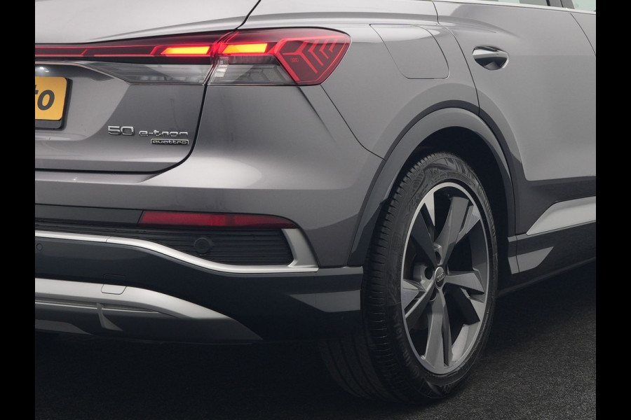 Audi Q4 e-tron 50 quattro S Line 77 kWh 299pk Dealer O.H. INCL BTW | Panodak | Lederen Sportstoelen Verwarmd | Keyless | Navigatie | Cruise Control | Virtual | DAB | Taifungrau Metallic |