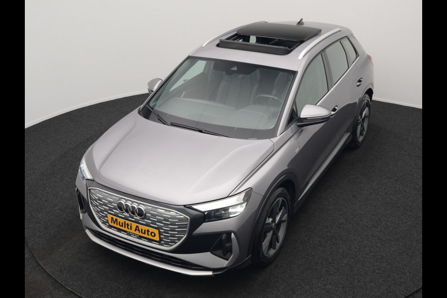 Audi Q4 e-tron 50 quattro S Line 77 kWh 299pk Dealer O.H. INCL BTW | Panodak | Lederen Sportstoelen Verwarmd | Keyless | Navigatie | Cruise Control | Virtual | DAB | Taifungrau Metallic |