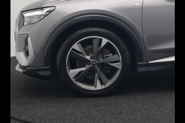 Audi Q4 e-tron 50 quattro S Line 77 kWh 299pk Dealer O.H. INCL BTW | Panodak | Lederen Sportstoelen Verwarmd | Keyless | Navigatie | Cruise Control | Virtual | DAB | Taifungrau Metallic |