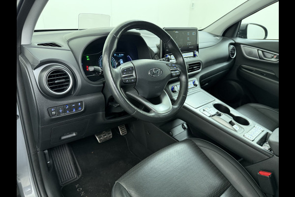 Hyundai Kona EV Premium 64kWh Leer SOH 100% Warmtepomp Krell®-Premium Audio Stoelverwarming+Koeling Camera Apple Carplay Android Auto Head-Up Stuurverwarming Elek.Stoelen Blind Spot Lane Assist VESS 1e Eigenaar Origineel Nederlandse Auto 45.000,-nieuw