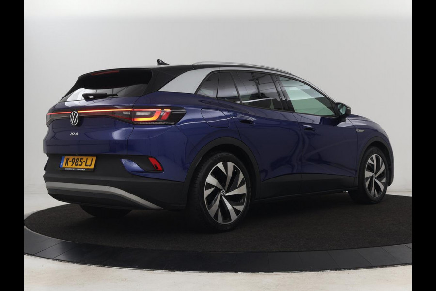 Volkswagen ID.4 First 77 kWh | Stoel & stuurverwarming | Camera | Carplay | Adaptive cruise | Half leder | 20'' | Navigatie | DAB | Sfeerverlichting
