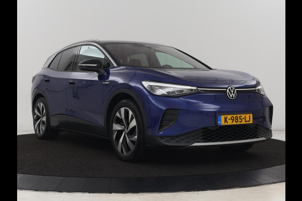 Volkswagen ID.4 First 77 kWh | Stoel & stuurverwarming | Camera | Carplay | Adaptive cruise | Half leder | 20'' | Navigatie | DAB | Sfeerverlichting