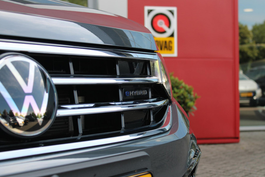 Volkswagen Tiguan 1.4 TSI 245PK eHybrid R-LINE BUSINESS + | BEKLEDING LEDER VIENNA | PANORAMISCH SCHUIF/KANTEL DAK | ELEKTRISCH WEGKLAPENBARE TREKHAAK | R-LINE INTERIEUR/EXTERIEUR | VERWARMBARE VOORSTOELEN/STUUR | ELEKTRISCH BEDIENBARE VOORSTOELEN MET GEHEUGEN FUNCTIE | AKOESTISCH GLAS GETINT | KEYLESS ACCESS/START | ELEKTRISCH BEDIENABRE ACHTERKLEP | DAKSPOILER R-LINE | SFEER VERLICHTING | RIJASSISTENT PAKKET O.A. LANE ASSIST EN ADAPTIVE CRUISE CONTROL EN DODEHOEK DETECTIE | NAVIGATIE | APPLE CARPLAY/ANDROID AUTO | DAB+ RADIO | LED MATRIX KOPLAMPEN (IQ LIGHT) | DRAADLOZE TELEFOONLADER