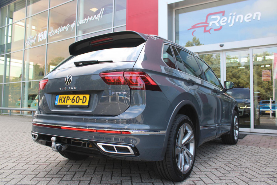 Volkswagen Tiguan 1.4 TSI 245PK eHybrid R-LINE BUSINESS + | BEKLEDING LEDER VIENNA | PANORAMISCH SCHUIF/KANTEL DAK | ELEKTRISCH WEGKLAPENBARE TREKHAAK | R-LINE INTERIEUR/EXTERIEUR | VERWARMBARE VOORSTOELEN/STUUR | ELEKTRISCH BEDIENBARE VOORSTOELEN MET GEHEUGEN FUNCTIE | AKOESTISCH GLAS GETINT | KEYLESS ACCESS/START | ELEKTRISCH BEDIENABRE ACHTERKLEP | DAKSPOILER R-LINE | SFEER VERLICHTING | RIJASSISTENT PAKKET O.A. LANE ASSIST EN ADAPTIVE CRUISE CONTROL EN DODEHOEK DETECTIE | NAVIGATIE | APPLE CARPLAY/ANDROID AUTO | DAB+ RADIO | LED MATRIX KOPLAMPEN (IQ LIGHT) | DRAADLOZE TELEFOONLADER