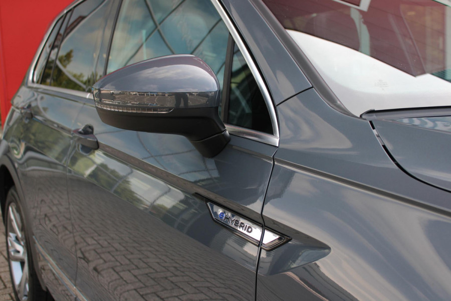 Volkswagen Tiguan 1.4 TSI 245PK eHybrid R-LINE BUSINESS + | BEKLEDING LEDER VIENNA | PANORAMISCH SCHUIF/KANTEL DAK | ELEKTRISCH WEGKLAPENBARE TREKHAAK | R-LINE INTERIEUR/EXTERIEUR | VERWARMBARE VOORSTOELEN/STUUR | ELEKTRISCH BEDIENBARE VOORSTOELEN MET GEHEUGEN FUNCTIE | AKOESTISCH GLAS GETINT | KEYLESS ACCESS/START | ELEKTRISCH BEDIENABRE ACHTERKLEP | DAKSPOILER R-LINE | SFEER VERLICHTING | RIJASSISTENT PAKKET O.A. LANE ASSIST EN ADAPTIVE CRUISE CONTROL EN DODEHOEK DETECTIE | NAVIGATIE | APPLE CARPLAY/ANDROID AUTO | DAB+ RADIO | LED MATRIX KOPLAMPEN (IQ LIGHT) | DRAADLOZE TELEFOONLADER