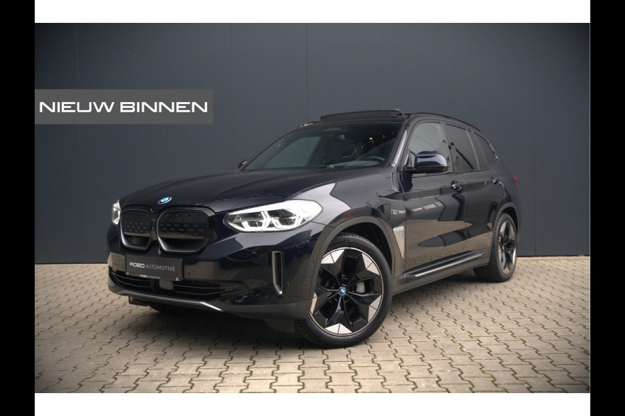 BMW iX3 High Executive 80 kWh | Panoramadak | Keyless | Stoelverwarming | Harman Kardon | Memory Seat | Head-Up Display | 360 Camera | Ambiance Verlichting | Trekhaak | Adaptive LED | Elektrische Stoelen | Apple Carplay |