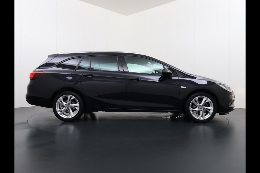 Opel Astra Sports Tourer 1.4 Turbo Trekhaak Navi Ecc Camera Pdc AGR-Comfort Stoel Apple Carplay Android Auto Stuur+Stoelverwarming Lane Assist Led Lmv 17" Regen-Lichtsensor Complete Opel Astra Tourer