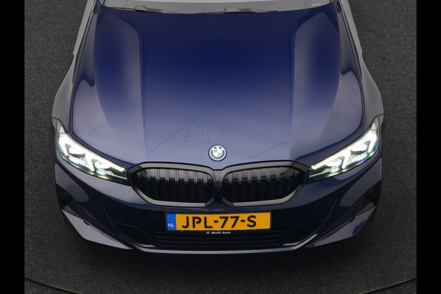 BMW 3 Serie Touring 320e Plug In Hybrid 204pk Dealer O.H. PHEV | Panodak | Widescreen Navi | Camera | Lederen Sportstoelen Verwarmd | Sfeerverlichting | Apple Carplay | Navigatie | Virtual | DAB | Tansanitblau II Metallic |