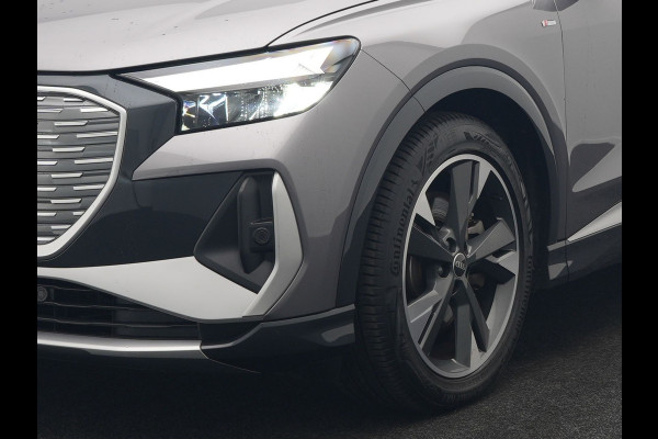 Audi Q4 e-tron 50 quattro S-Line 77 kWh 299pk Dealer O.H. Incl. BTW | Panodak | SOH 93,2% | Lederen Sportstoelen Verwarmd | 20"L.M  | Navigatie | Cruise Control | Virtual | DAB | Taifungrau Metallic |