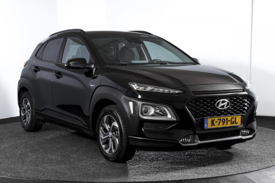 Hyundai Kona 1.6 GDI HEV Comfort - Automaat | Cruise | PDC | Camera | NAV + App. Connect | ECC | Afn. Trekhaak | DAB | LM 16" |
