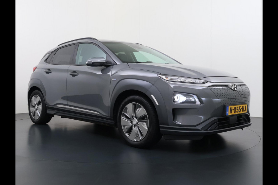 Hyundai Kona EV Premium 64 kWh SKY|VAN: €20.900,- VOOR: €18.877,- UW EINDEJAARSVOORDEEL: €2.023,-|  3-FASE| STOEL + STUURVERWARMING| STOEL VENTILATIE| AFN. TREKHAAK| DODE HOEK | CAMERA| HEAD-UP DISPLAY| PANO|