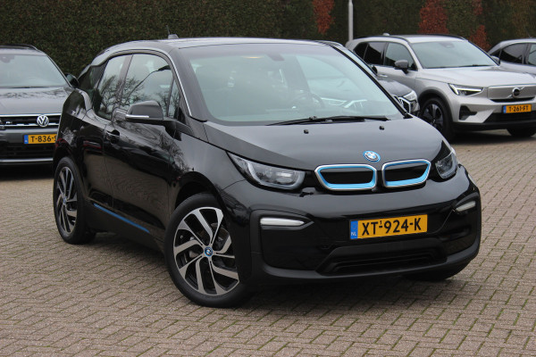 BMW i3 Basis 120Ah 42 kWh / SoH 91.4% Navigatie / 19'' / Parkeerhulp achter / Navigatie / Harman Kardon / Stoelverwarming / Cruise Control / Warmtepomp / Getint glas