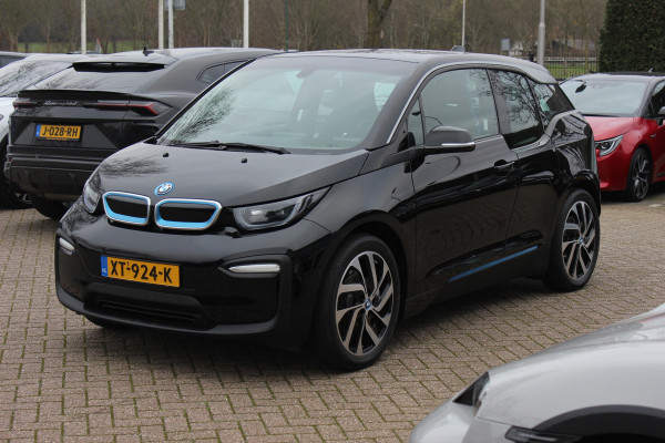 BMW i3 Basis 120Ah 42 kWh / SoH 91.4% Navigatie / 19'' / Parkeerhulp achter / Navigatie / Harman Kardon / Stoelverwarming / Cruise Control / Warmtepomp / Getint glas