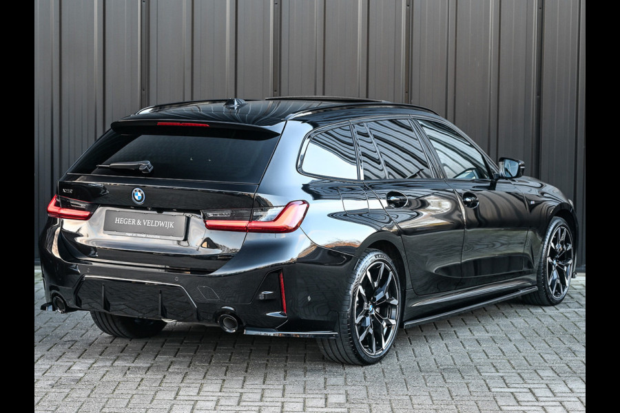 BMW 3 Serie Touring 330e xDrive · M sport · Accu 19,5kWh · Trekhaak · Panoramadak · Active Cruise · Camera · Ambiance interieur ·