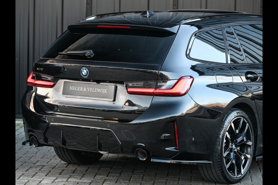 BMW 3 Serie Touring 330e xDrive · M sport · Accu 19,5kWh · Trekhaak · Panoramadak · Active Cruise · Camera · Ambiance interieur ·