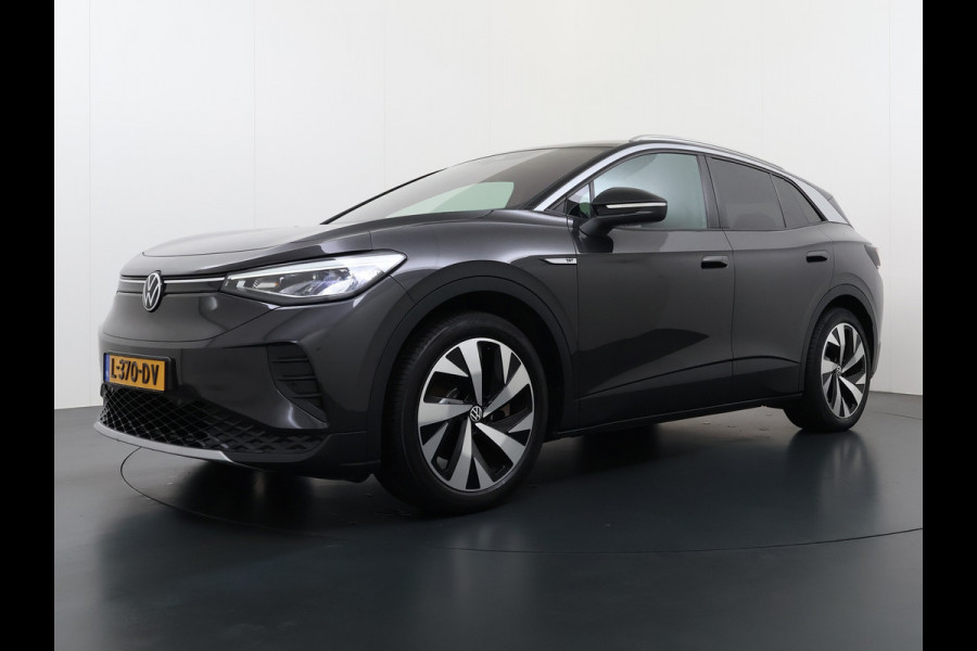 Volkswagen ID.4 204pk 1st 77kWh Trekhaak Leer/Alcantara Adap.Cruise Camera Warmtepomp Apple Carplay Android Navi Ecc Pdc-a+v Lmv 20" Stoelverwarming Led Bordherkenning Voor-Klimatisering Semi-Autopilot  Elektrisch-Wegklapbare Trekhaak App-Connect  E-sound Front-Assist Origineel Nederlandse Auto SOH 86%