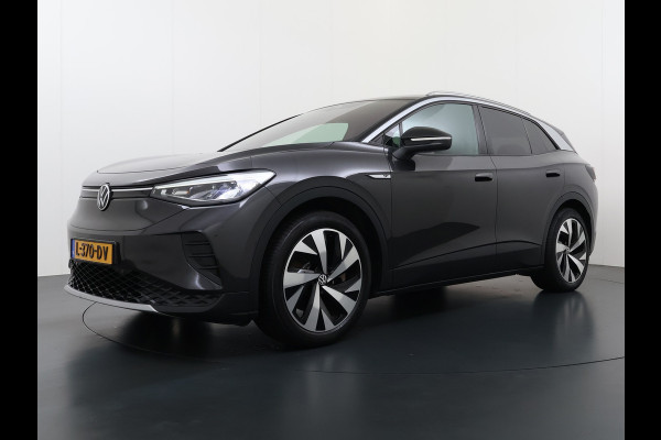 Volkswagen ID.4 204pk 1st 77kWh Trekhaak Leer/Alcantara Adap.Cruise Camera Warmtepomp Apple Carplay Android Navi Ecc Pdc-a+v Lmv 20" Stoelverwarming Led Bordherkenning Voor-Klimatisering Semi-Autopilot  Elektrisch-Wegklapbare Trekhaak App-Connect  E-sound Front-Assist Origineel Nederlandse Auto SOH 86%