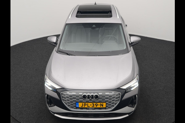 Audi Q4 e-tron 50 quattro S-Line 77 kWh 299pk Dealer O.H. Incl. BTW | Panodak | SOH 93,2% | Lederen Sportstoelen Verwarmd | 20"L.M  | Navigatie | Cruise Control | Virtual | DAB | Taifungrau Metallic |
