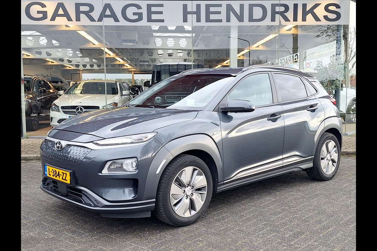 Hyundai Kona EV Premium 64 kWh | SOH: 94,6% | Leder | Warmtepomp | Adaptive CC | Navi | Camera |